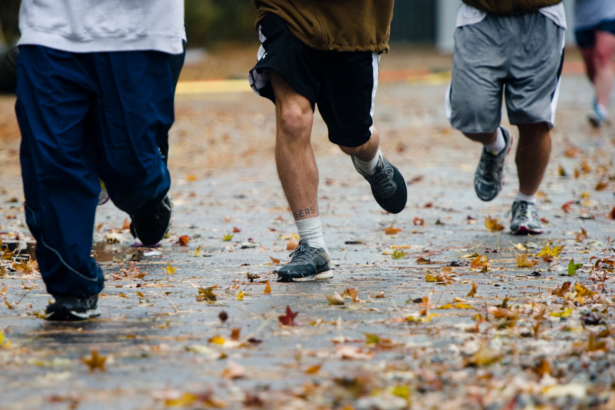 U.S. Service members take part in the Thanksgiving Turkey Trot 3K run at the Langley Transit Center as part of their Thanksgiving celebration at Joint Base Langley-Eustis, Va., during their controlled monitoring period, Nov. 27, 2014. The members recently returned from Liberia supporting Operation United Assistance, a Department of Defense operation in Liberia to provide logistics, training and engineering support to U.S. Agency for International Development-led efforts to contain the Ebola virus outbreak in West Africa. (U.S. Air Force photo by Staff Sgt. Gustavo Gonzalez/Released)