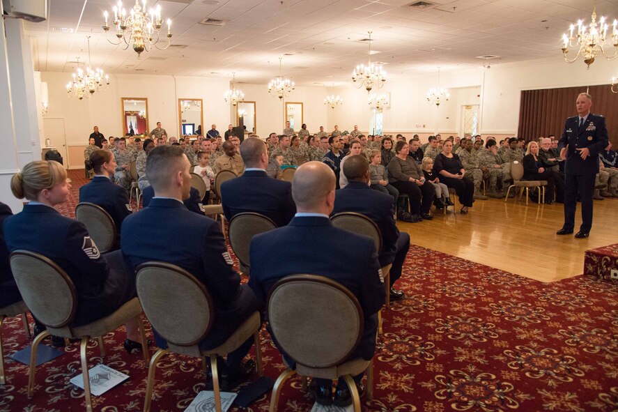 Col. Michael A. Vogel, 66th Air Base Group commander, addresses newly promoted Airmen during the December monthly enlisted promotion ceremony at the Minuteman Commons Nov. 26. Eight enlisted members were recognized during the month event that provided the community a chance to recognize Airman selected for promotion. (U.S. Air Force photo by Mark Herlihy)