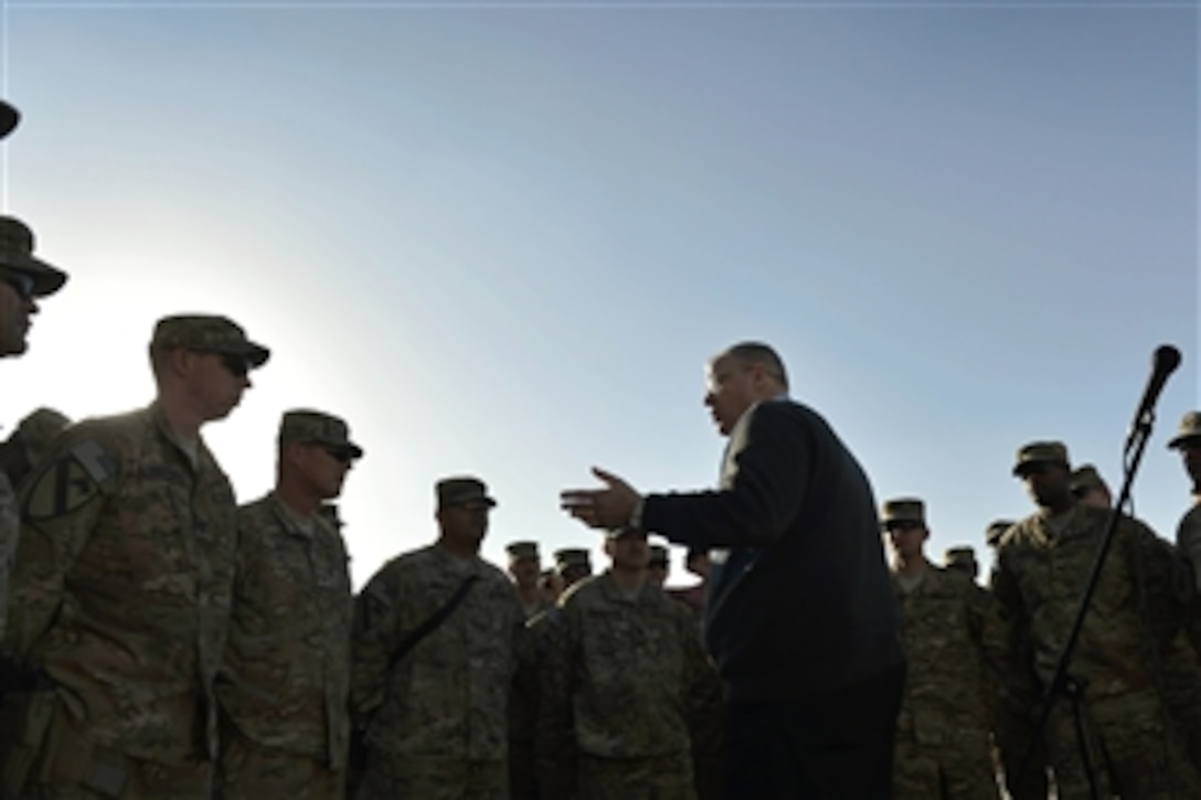 U.S. Deputy Defense Secretary Bob Work engages with troops at the Train, Advise and Assist Command South headquarters on Kandahar Airfield, Afghanistan, Nov. 28, 2014. Work traveled to Afghanistan to personally thank deployed troops on Thanksgiving Day for their service and sacrifice this holiday season.