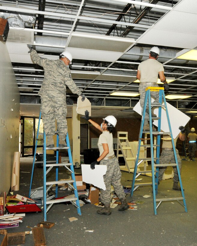 Members of the 156th Civil Engineer Squadron, Puerto Rico National Guard, get valuable training while removing ceiling and interior partition walls from abandoned school, April 13, 2014, in New London, N.C.  The school campus is being renovated and transform into a 2nd Tarheel ChalleNGe site scheduled to open May 2015. Tarheel ChalleNGe is a quasi-military style program that helps teens, ages 16 to 18, get their GED and develop life coping skills to prepare them for future employment or further education endeavors. (U.S. Air National Guard photo by Master Sgt. Patricia F. Moran, 145th Public Affairs/Released)