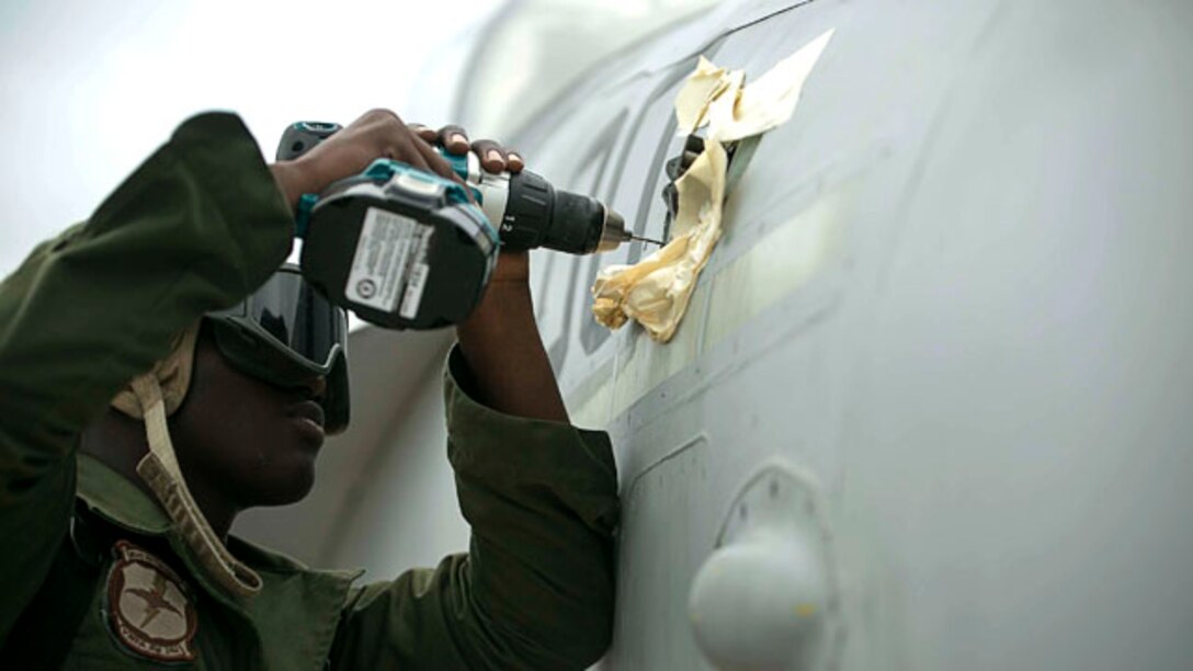 Cpl. Michael P. Hinds, from Queens, N.Y., works on an FA-18 Hornet Sept. 29 during Forager Fury III on Andersen Air Force Base. He is doing routine maintenance to ensure the safety of the pilot. Hinds is an airframes mechanic with Marine All Weather Fighter Attack Squadron 242, Marine Aircraft Group 12, 1st Marine Aircraft Wing, III Marine Expeditionary Force. (U.S. Marine Corps photo by Lance Cpl. Tyler Ngiraswei/ Released)