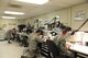 Air Force Repair/Enhancement (AFREP) Airmen work at their stations on various broken parts at Dyess Air Force Base, Texas. Airmen who work in AFREP are brought in from different shops on base for a three-year period. Each has his or her own specialty skills to contribute to more complex projects. (U.S. Air Force photo by Airman 1st Class Alexander Guerrero)