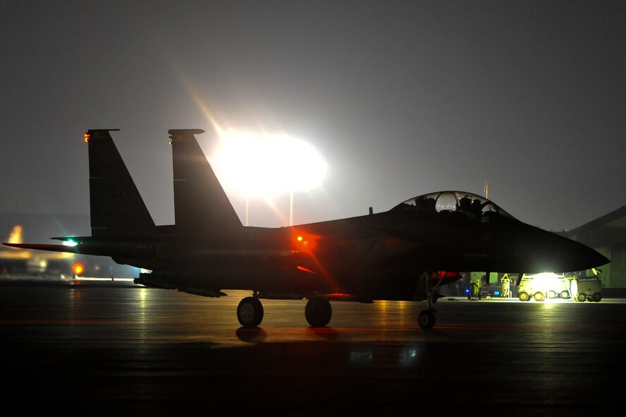 An F-15E Strike Eagle waits to launch in the U.S. Central Command area of responsibility prior to strike operations in Syria Sept. 23, 2014. These aircraft were part of a large coalition strike package that was the first to strike ISIL targets in Syria. (U.S. Air Force photo by Tech. Sgt. Russ Scalf)