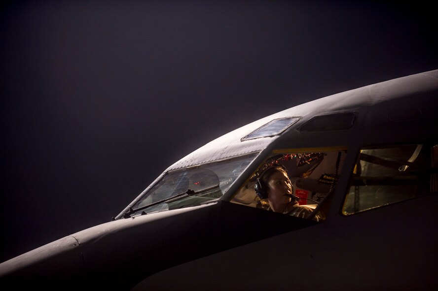 U.S. Air Force Maj. Gena Fedoruk, a KC-135 Stratotanker pilot with the 340th Expeditionary Air Refueling Squadron, pre-flights her aircraft before taking off from a base in the U.S. Central Command Area of Responsibility in support of a mission conducting airstrikes in Syria, Sept. 23, 2014. Multiple KC-135 Stratotankers were part of a large coalition strike package that was the first to strike ISIL targets in Syria. (U.S. Air Force photo by Senior Airman Matthew Bruch/Released)