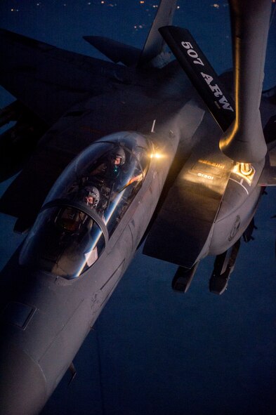 A U.S. Air Force F-15E Strike Eagle receives fuel from a KC-135 Stratotanker over northern Iraq after conducting airstrikes in Syria, Sept. 23, 2014. These aircraft were part of a large coalition strike package that was the first to strike ISIL targets in Syria. (U.S. Air Force photo by Senior Airman Matthew Bruch/Released)