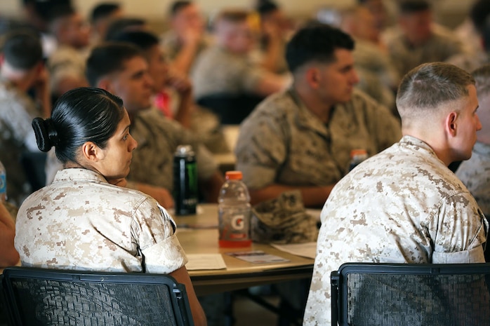 Marines and Sailors with the 24th Marine Expeditionary Unit listen to a pre-deployment brief at Marston Pavilion aboard Camp Lejeune, N.C., Sept. 30, 2014. Service members received classes and instructions regarding personal belongings and family affairs in preparation of the deployment at the end of the year.