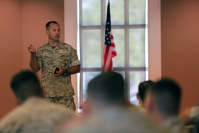 Colonel Scott F. Benedict, the commanding officer of 24th Marine Expeditionary Unit, speaks to Marines and Sailors during a pre-deployment brief at (Major General John?) Marston Pavilion aboard Camp Lejeune, N.C., Sept. 30, 2014. Service members received classes and instructions regarding personal belongings and family affairs in preparation of the deployment at the end of the year.