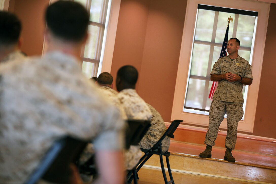 Colonel Scott F. Benedict, the commanding officer of 24th Marine Expeditionary Unit, speaks to Marines and Sailors during a pre-deployment brief at (Major General John?) Marston Pavilion aboard Camp Lejeune, N.C., Sept. 30, 2014. Service members received classes and instructions regarding personal belongings and family affairs in preparation of the deployment at the end of the year.