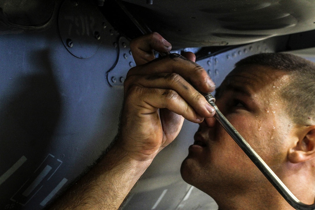 Lance Cpl. Dalton C. Bailey, a plane captain with Marine Medium Tiltrotor Squadron 365 (Reinforced), 24th Marine Expeditionary Unit, and a native of Pittsburg, Pa., removes the forward thrust nozzle for the engine of an AV-8B Harrier at Marine Corps Air Station Cherry Point, N.C., Sept. 30, 2014. VMM-365 (Rein) conducts maintenance to make sure all aircraft are prepared for Composite Training Unit Exercise, the third major pre-deployment exercise in preparation of the deployment at the end of the year.  