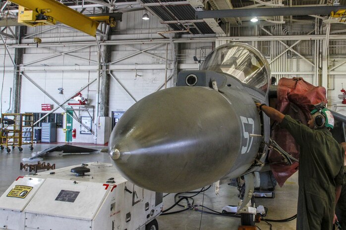 Corporal Chase C. Baker, a collateral duty inspector with Marine Medium Tiltrotor Squadron 365 (Reinforced), 24th Marine Expeditionary Unit, and native of Huntington, W. Va., conducts maintenance on the rigging of a yaw system for the rudder of an AV-8B Harrier at Marine Corps Air Station Cherry Point, N.C., Sept. 30, 2014. VMM-365 (Rein) conducts maintenance to make sure all aircraft are prepared for Composite Training Unit Exercise, the fourth major pre-deployment exercise in preparation of the deployment at the end of the year.  