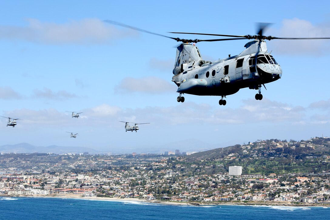 U.S. Marines with Marine Medium Helicopter Squadron (HMM) 364, Marine Aircraft Group 39, 3rd Marine Aircraft Wing (MAW), fly CH-46E Sea Knight helicopters over San Diego, Calif., March 31, 2014. After 47 years of flying the CH-46, HMM-364, “Flies the Barn”, taking off and landing in unison and flying in mass formations, signifying the transition to the MV-22 Osprey. (U.S. Marine Corps photo by Sgt. Keonaona C. Paulo, 3rd MAW Combat Camera/Released)