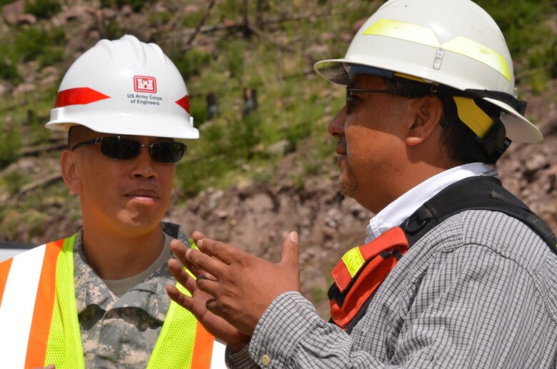 South Pacific Division Commander Brig. Gen. Mark Toy, left, and Santa Clara Pueblo Gov. Michael Chavarria, discuss flood mitigation at the Santa Clara burn scar.