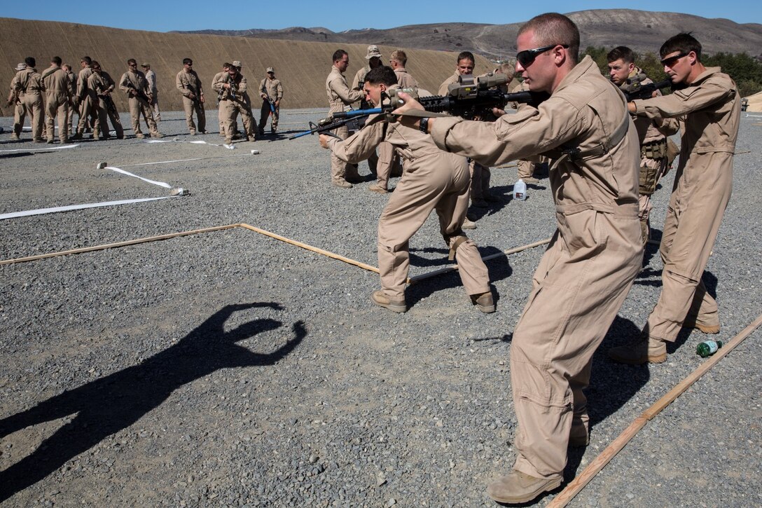 U.S. Marines with Bravo Company, 1st Reconnaissance Battalion, practice clearing rooms during a close-quarters tactics course aboard Camp Pendleton, Calif., Sept. 25, 2014. These Marines are enhancing their skills before compositing with the 15th Marine Expeditionary Unit in October. (U.S. Marine photo by Cpl. Anna Albrecht/Released)