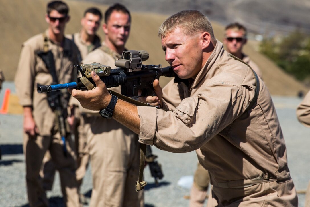 Petty Officer 2nd Class Jesse James practices clearing a room during a dry-fire drill at a close-quarters tactics course aboard Camp Pendleton, Calif., Sept. 25, 2014. James is a corpsman with Bravo Company, 1st Reconnaissance Battalion. These Marines are enhancing their skills before compositing with the 15th Marine Expeditionary Unit in October. (U.S. Marine photo by Cpl. Anna Albrecht/Released)