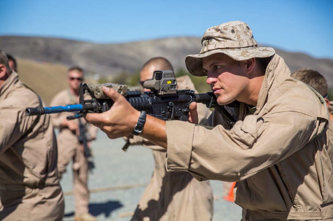 U.S. Marine Sgt. Andy Muller aims in during a dry-fire drill at a close-quarters tactics course aboard Camp Pendleton, Calif., Sept. 25, 2014. Muller is a receiver-transmitter operator with Bravo Company, 1st Reconnaissance Battalion. These Marines are enhancing their skills before compositing with the 15th Marine Expeditionary Unit in October. (U.S. Marine photo by Cpl. Anna Albrecht/Released)