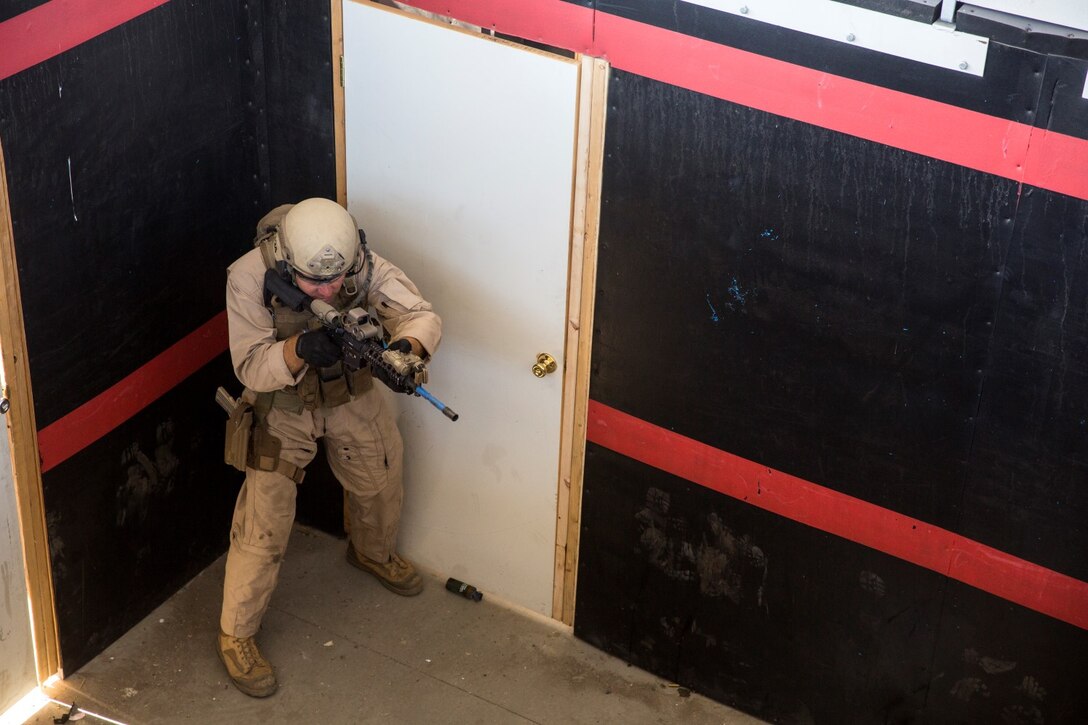 A U.S. Marine with Bravo Company, 1st Reconnaissance Battalion, clears a room during a close-quarters tactics course aboard Camp Pendleton, Calif., Sept. 25, 2014. These Marines are enhancing their skills before compositing with the 15th Marine Expeditionary Unit in October. (U.S. Marine photo by Cpl. Anna Albrecht/Released)
