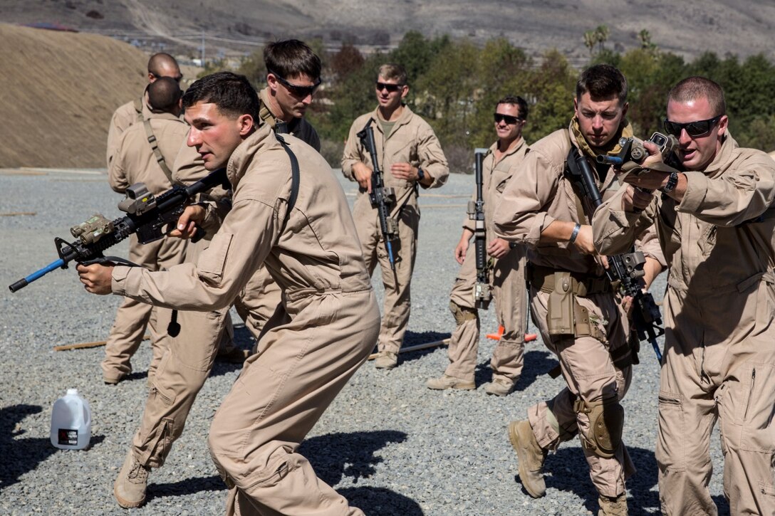 U.S. Marines with Bravo Company, 1st Reconnaissance Battalion, practice clearing rooms during a close-quarters tactics course aboard Camp Pendleton, Calif., Sept. 25, 2014. These Marines are enhancing their skills before compositing with the 15th Marine Expeditionary Unit in October. (U.S. Marine photo by Cpl. Anna Albrecht/Released)