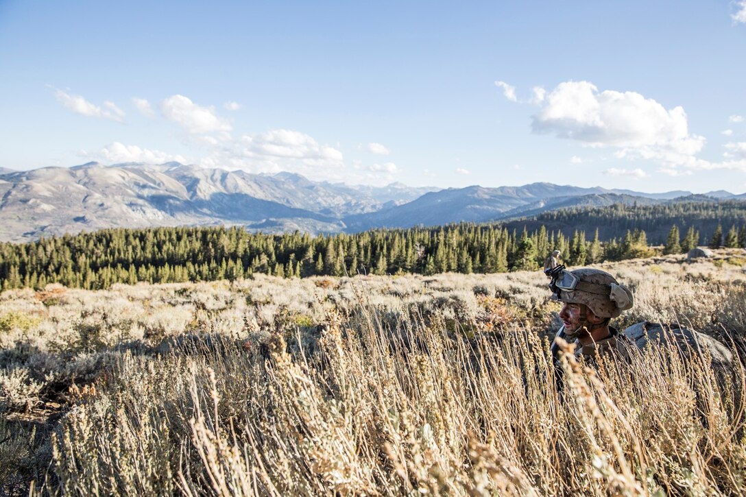 U.S. Marine Lance Cpl. Jonathan Ladowski sits in a defensive position during Mountain Exercise 2014 aboard Marine Corps Mountain Warfare Training Center in Bridgeport, Calif., Sept. 8, 2014. Ladowski, 20, from St. John, Ind., infantry rifleman with 1st Platoon, Lima Company, 3rd Battalion, 1st Marine Regiment. Marines with 3/1 will become the 15th Marine Expeditionary Unit’s ground combat element in October. (U.S. Marine Corps photo by Sgt. Emmanuel Ramos/Released)
