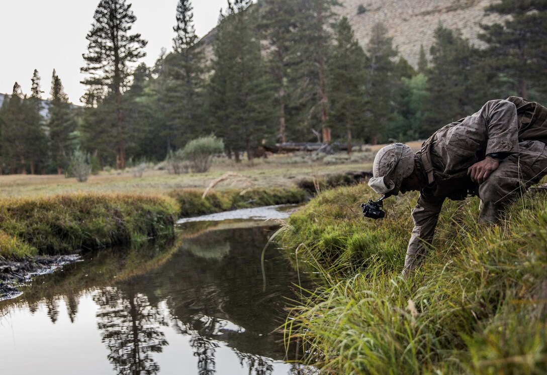 U.S. Marine Lance Cpl. Cody Carter conducts a water resupply during Mountain Exercise 2014 aboard Marine Corps Mountain Warfare Training Center in Bridgeport, Calif., Sept. 8, 2014. Carter, 19, from Iron River, Mich., infantry rifleman with 1st Platoon, Lima Company, 3rd Battalion, 1st Marine Regiment. Marines with 3/1 will become the 15th Marine Expeditionary Unit’s ground combat element in October. (U.S. Marine Corps photo by Sgt. Emmanuel Ramos/Released)
