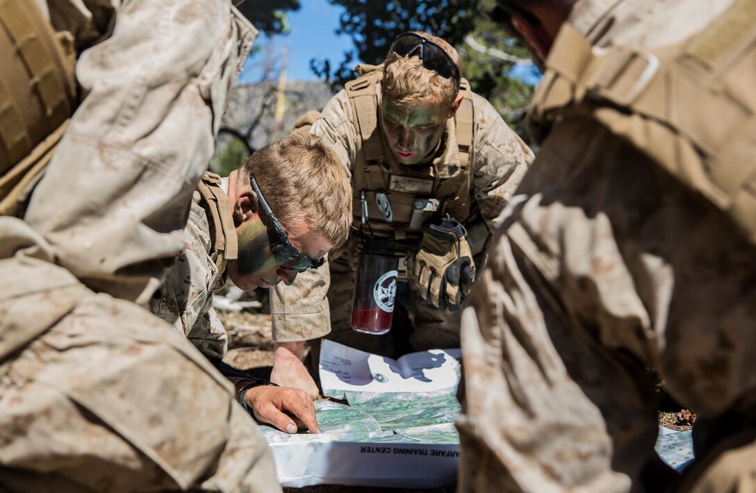 U.S. Marine Sgt. Joshua Germond, left, plans a scheme of maneuver with his squad leaders during Mountain Exercise 2014 aboard Marine Corps Mountain Warfare Training Center in Bridgeport, Calif., Sept. 9, 2014. Germond, 24, is from Knappa, Ore., platoon sergeant, 1st Platoon, Lima Company, 3rd Battalion, 1st Marine Regiment. Marines with 3/1 will become the 15th Marine Expeditionary Unit’s ground combat element in October. (U.S. Marine Corps photo by Sgt. Emmanuel Ramos/Released)