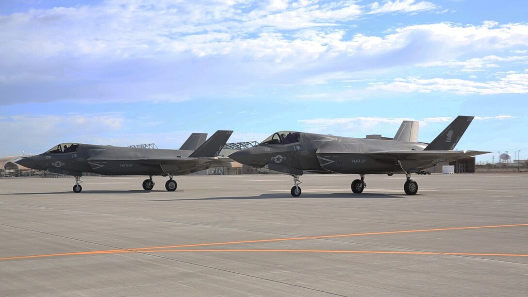Two F-35B Lightning IIs, with Marine Fighter Attack Squadron (VMFA) 121 “Green Knights,” wait on the flight line before going on a training flight aboard Marine Corps Air Station Yuma, Arizona, Aug. 18. The F-35 is scheduled to appear for the first time at the 2014 Miramar Air Show, Oct. 3-5. 