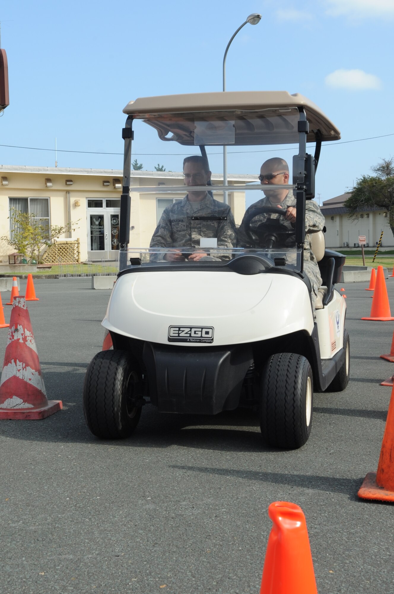 U.S. Air Force Tech. Sgt. Logan McKeown, 35th Fighter Wing NCO in charge of ground safety, and U.S. Air Force Staff Sgt. Miguel Campos, 35th Maintenance Squadron avionics technician, conduct a texting-and-driving-simulation during a distracted driving course on Resilient Airmen Day at Misawa Air Base, Japan, Sept. 29, 2014. The course allowed Airmen to experience the dangers of distracted driving firsthand. (U.S. Air Force photo by Airman Jordyn Rucker)