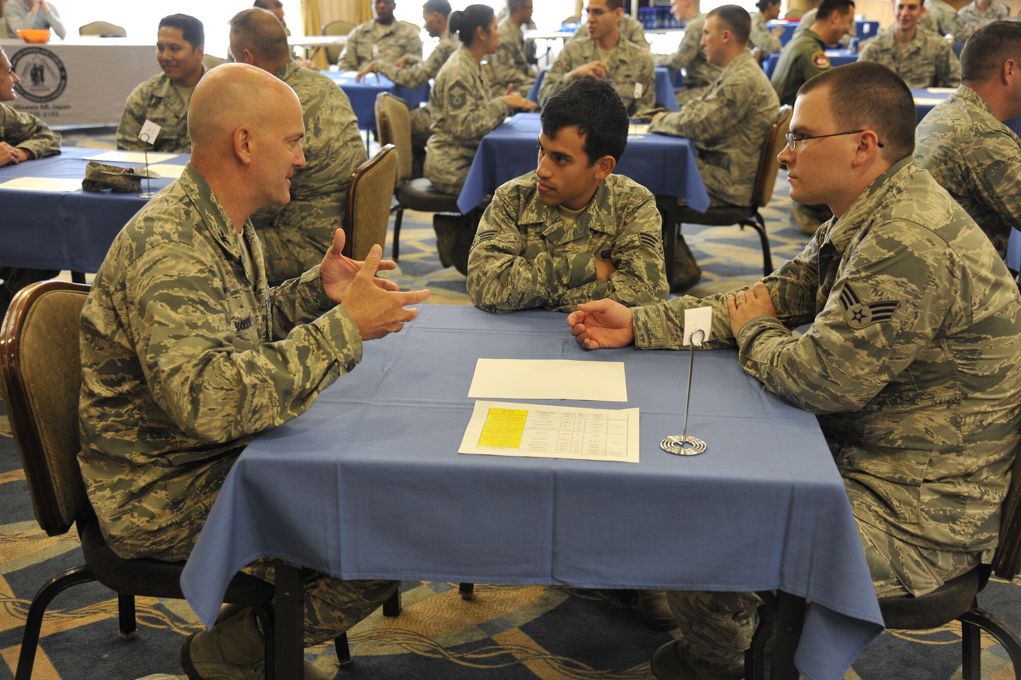 U.S. Air Force Col. Andrew Hansen, 35th Fighter Wing Vice Commander, speaks with junior enlisted Airmen during a speed mentoring session on Resilient Airman Day at Misawa Air Base, Japan, Sept 29, 2014. Hansen, along with other senior leadership, speaks to young Airmen about career progression, pursuit of education, time management and other issues important to their career. (U.S. Air Force photo by Airman 1st Class Patrick S. Ciccarone/Released)