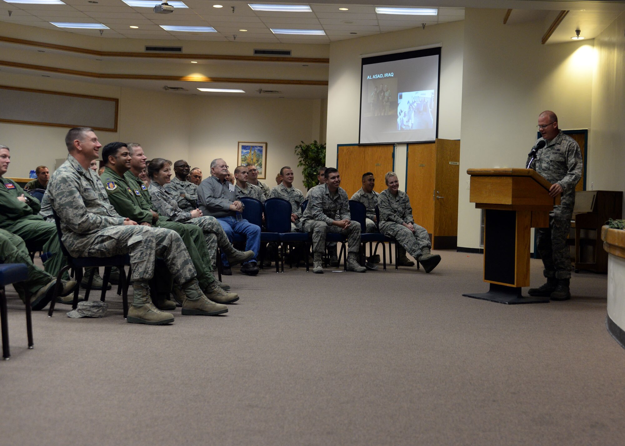 ALTUS AIR FORCE BASE, Okla. – U.S. Air Force Tech. Sgt. Randy Crum, 97th Civil Engineer Squadron NCO in charge of pavements and heavy equipment shares his Rapid Engineer Deployable Heavy Operational Repair Squadron Engineer experiences with members of the 97th Air Mobility Wing during a 97th Civil Engineer Squadron heritage brief at the Freedom Community Center, Oct. 1, 2014. RED HORSE units are responsible for major projects being constructed at new forward operating bases. (U.S. Air Force photo by Senior Airman Franklin R. Ramos/Released)