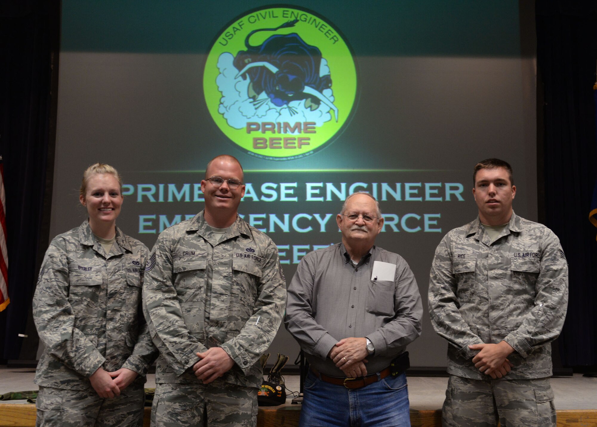 ALTUS AIR FORCE BASE, Okla. – U.S. Air Force Senior Airman Brooke Byerley, 97th Civil Engineer Squadron engineering assistant, U.S. Air Force Tech. Sgt. Randy Crum, 97th NCO in charge of pavements and heavy equipment, Leon K. Pike, a U.S. Air Force veteran and U.S. Air Force Senior Airman Devin Rice, 97th heavy equipment operator, pose for a photo during a 97th heritage brief at the Freedom Community Center, Oct. 1, 2014. The 97th held a briefing to educate Airmen about the heritage of both Prime Base Engineering Emergency Force and Rapid Engineer Deployable Heavy Operational Repair Squadron Engineer. (U.S. Air Force photo by Senior Airman Franklin R. Ramos/Released)