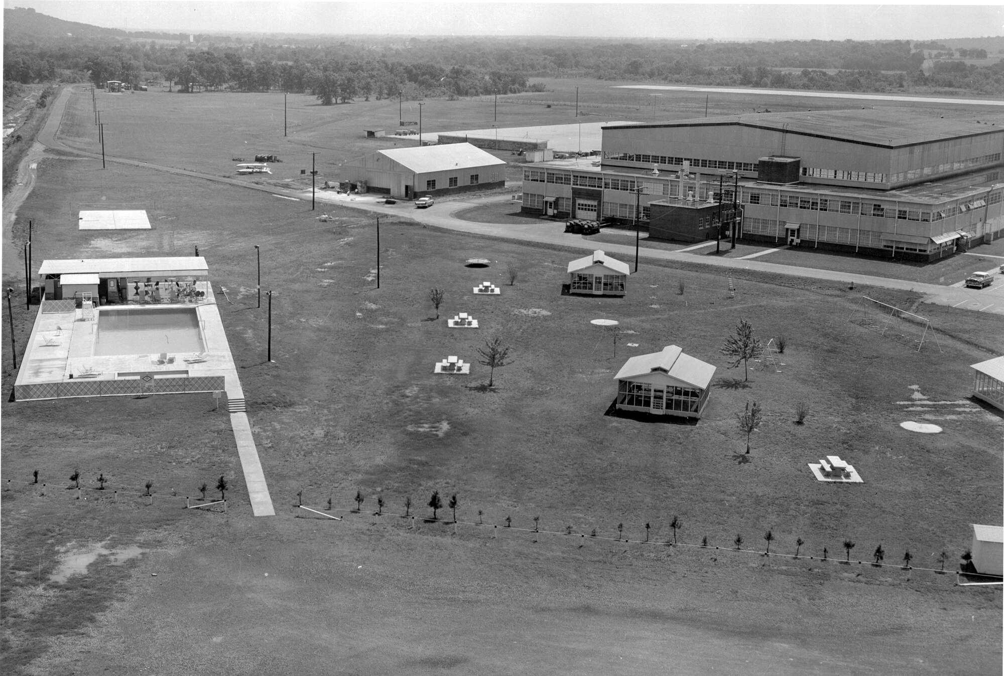 This image features an aerial view of Ebbing Air National Guard Base, Fort Smith, Arkansas when it had a recreational area between the hangar and the pool. Since then, the recreational area has been replaced by the 188th Medical Group/188th Communications Flight building. (Courtesy photo)