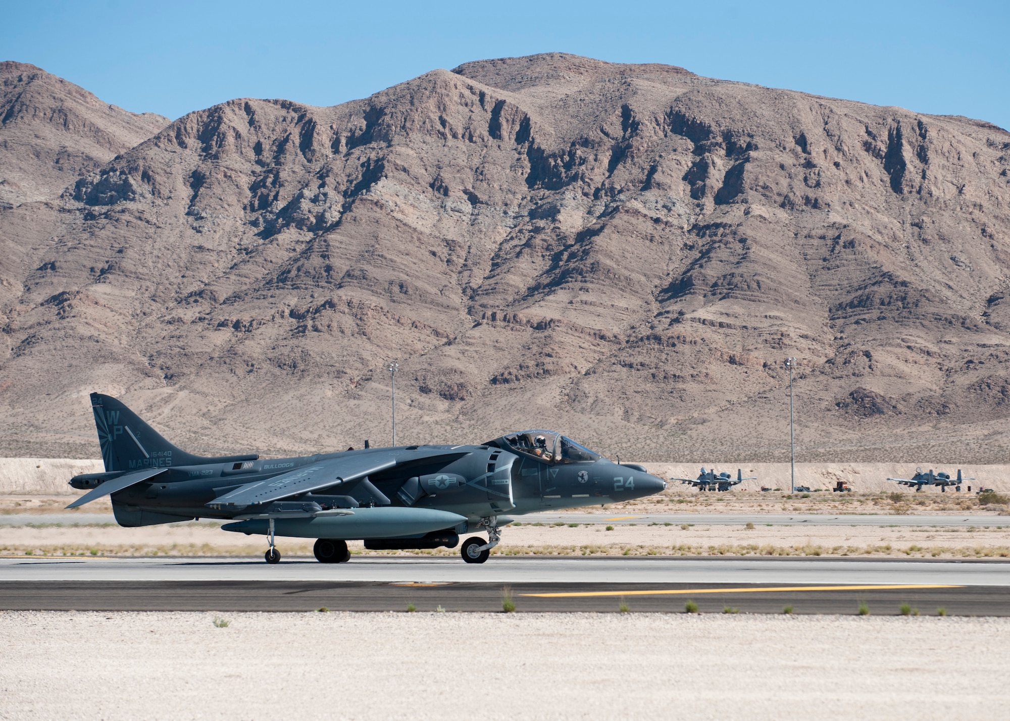A U.S. Marine Corps AV-8B Harrier assigned to Marine Attack Squadron 223, Marine Corps Air Station Cherry Point, N.C., lands during Green Flag West 14-10 at Nellis Air Force Base, Nev., Sept. 24, 2014. The Harrier was at Nellis in support of Green Flag West 14-10. (U.S. Air Force photo by Airman 1st Class Thomas Spangler) 