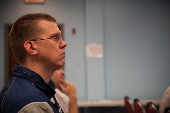 U.S. Air Force Capt. Bradley Amys, 23d Wing deputy staff judge advocate, listens during a Comprehensive Airman Fitness group discussion Sept. 30, 2014, at Moody Air Force Base, Ga. CAF is a program designed to build on an Airman’s core values through strengthening his or her mental, physical, social and spiritual fitness. (U.S. Air Force photo by Airman 1st Class Dillian Bamman/Released)