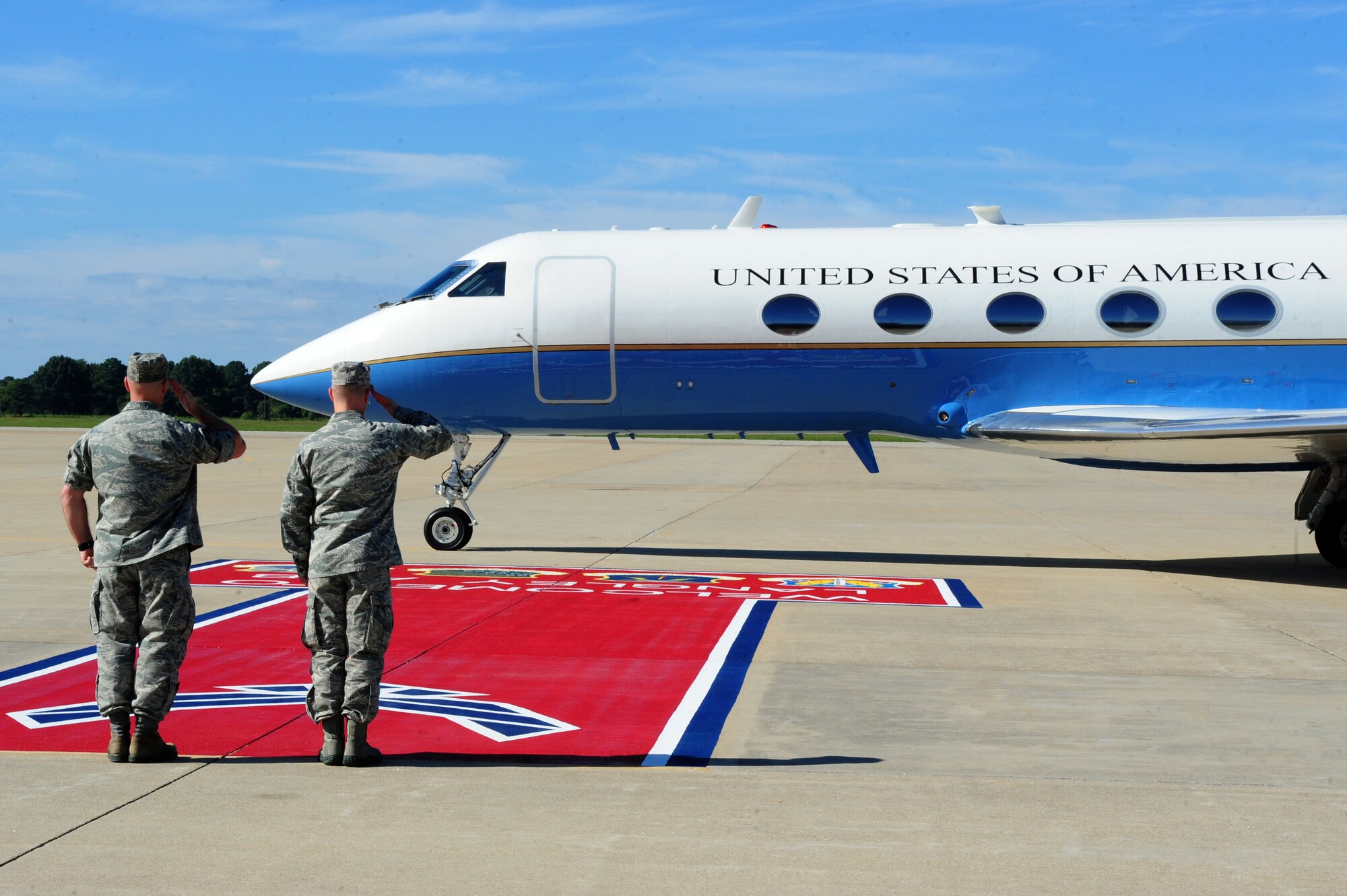 U.S. Air Force Col. Timothy D. Haugh, 480th Intelligence, Surveillance and Reconnaissance Wing  commander, and Chief Master Sgt. Edward Slacum 480th ISRW interim command chief, render salutes as Colombian Gen. Juan Pablo Rodriguez, Armed Forces, Colombia commander, departs Langley Air Force Base, Va., Sept. 26, 2014. Throughout the visit, the 480th ISRW shared best practices on handling ISR information their Colombian counterparts. (U.S. Air Force Photo by Airman 1st Class Areca T. Wilson/Released) 