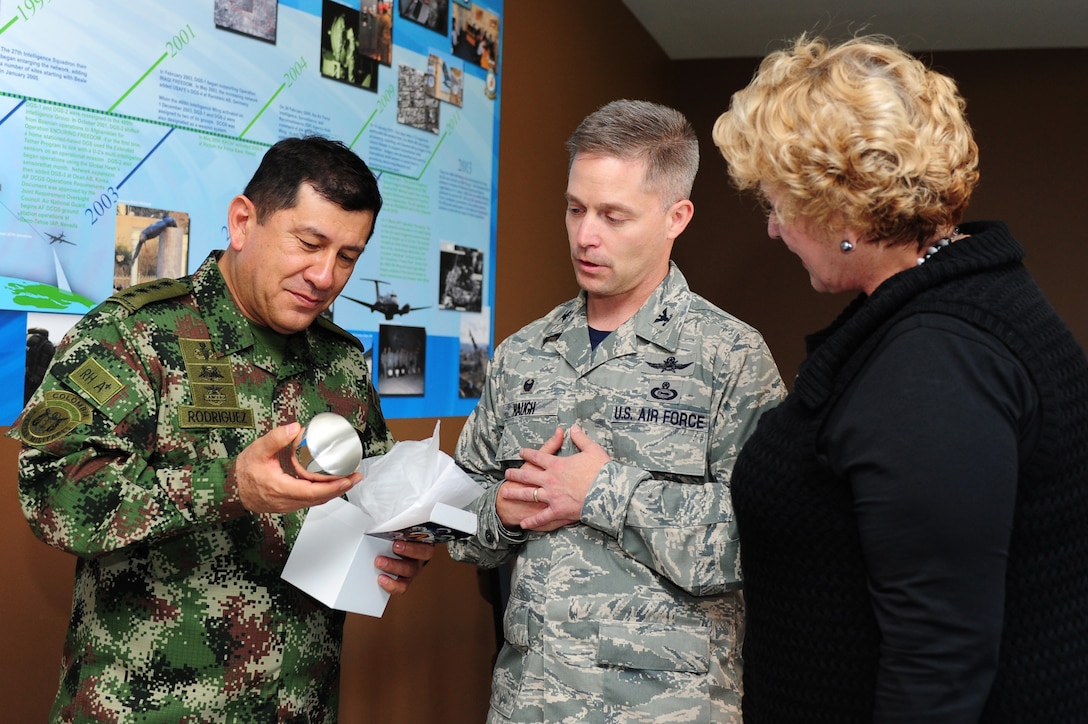 Colombian Gen. Juan Pablo Rodriguez, Armed Forces, Colombia commander receives a gift from U.S. Air Force Col. Timothy D. Haugh, 480th Intelligence, Surveillance and Reconnaissance Wing commander, at Langley Air Force Base, Va., Sept. 26, 2014. Rodriguez’s visited to further military-to-military relations between both nations.  (U.S. Air Force Photo by Airman 1st Class Areca T. Wilson/Released) 