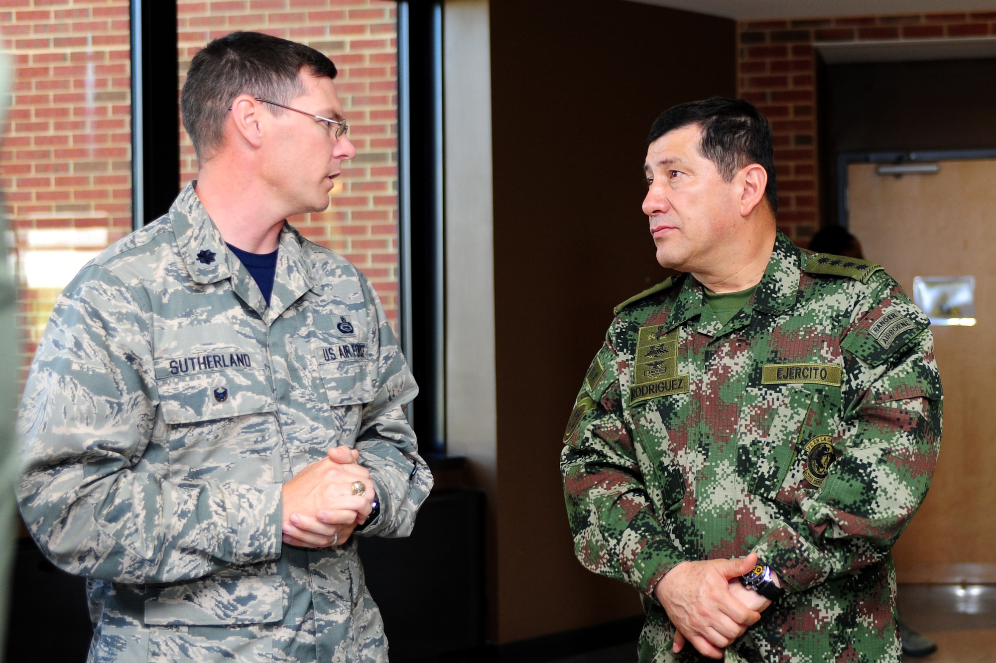 U.S. Air Force Lt. Col. Pat Sutherland, 497th Intelligence, Surveillance and Reconnaissance Group deputy commander briefs Colombian Gen. Juan Pablo Rodriguez, Armed Forces, Colombia commander, on the 497th ISRG mission at Langley Air Force Base Va., Sept. 26, 2014. One objective for the visit was to assist Colombia with ISR capabilities and the exploitation and dissemination of intelligence information. (U.S. Air Force Photo by Airman 1st Class Areca T. Wilson/Released) 