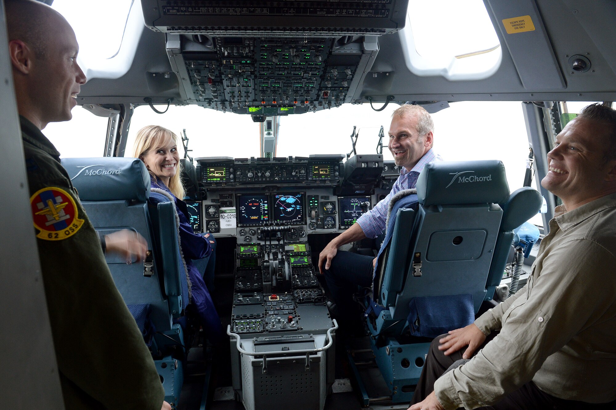 Capt. Clifford Caldwell (left), 62nd Operations Support Squadron director of wing weapons and tactics, briefs representatives from Disney’s Apprenticeship Program on the flight deck of a C-17 Globemaster III, Sept. 29, 2014, during their tour at Joint Base Lewis-McChord, Wash. The Disney Apprenticeship Program offers transitioning service members from JBLM the opportunity to pursue a career with the Walt Disney Company. (U.S. Air Force photo/Airman 1st Class Keoni Chavarria) 