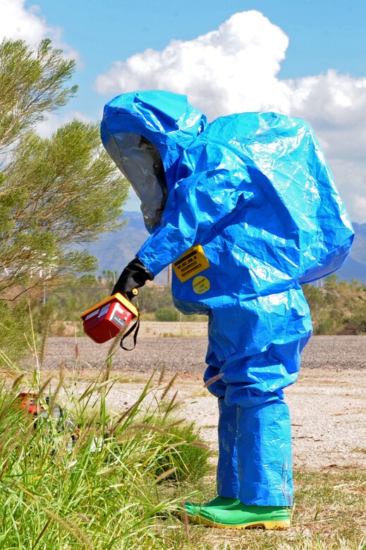 U.S. Air Force Senior Airman Calvin Macatangay, 355th Aerospace Medicine Squadron bioenvironmental engineering technician, uses a radiation survey meter to check the surrounding area during a Multi-Agency HAZMAT Exercise at Davis-Monthan Air Force Base, Ariz., Sept. 29, 2014. The survey meter is used to locate contamination or detect radioactive material. (U.S. Air Force photo by Airman 1st Class Cheyenne Morigeau/Released)

