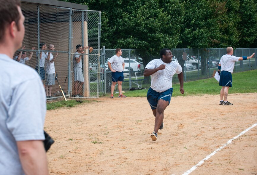 Javaris Hicks, 23d Civil Engineer Squadron, runs to home base during a Super Sports Day softball game Sept. 30, 2014, at Moody Air Force Base, Ga. The 23d CES went on to beat the 71st Rescue Squadron 8 to 5. (U.S. Air Force photo by Senior Airman Jarrod Grammel/Released)
