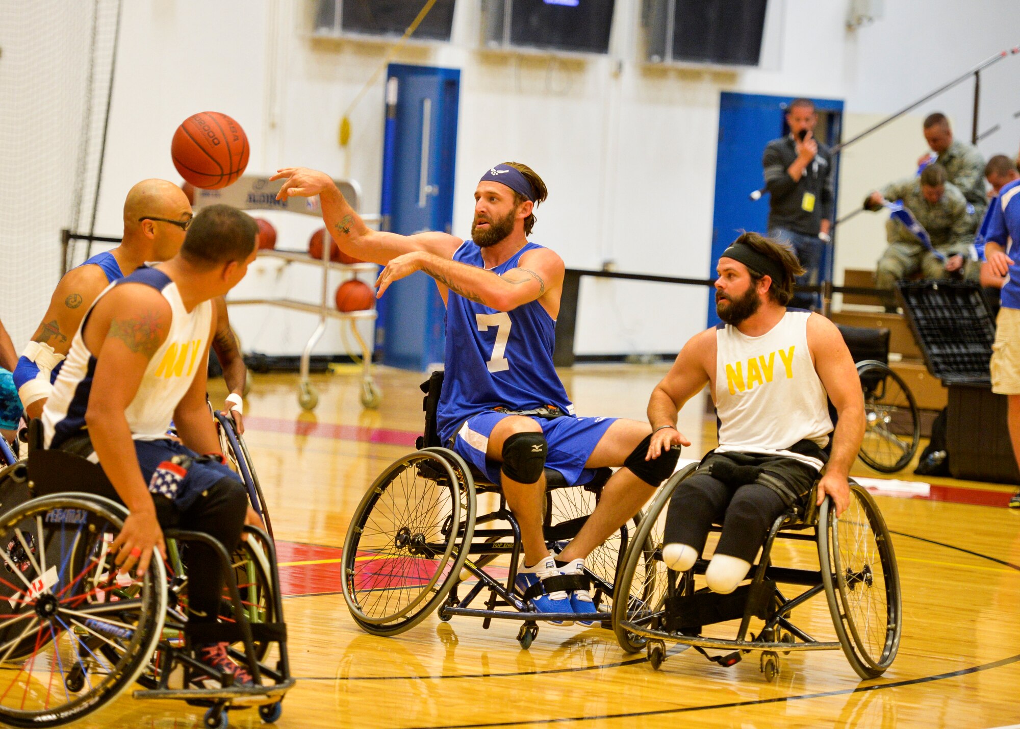 Retired Senior Airman Ryan Gallo makes a pass during the Air Force wheelchair basketball game against the Navy at the 2014 Warrior Games Sept. 29, 2014, at the United States Olympic Training Center in Colorado Springs, Colo. The Air Force team lost 38-19 and will play Special Operations in the next round. (U.S Air Force photo/Staff Sgt. Devon Suits)