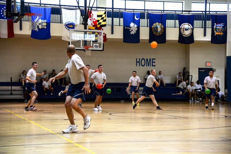 Airmen from the 71st Rescue Squadron and 823d Base Defense Squadron play dodge ball during Super Sports Day at Sept. 30, 2014 at Moody Air Force Base, Ga. Units from around the base participated in a variety of sporting events to promote physical fitness. (U.S. Air Force photo by Senior Airman Sandra Marrero/Released)
