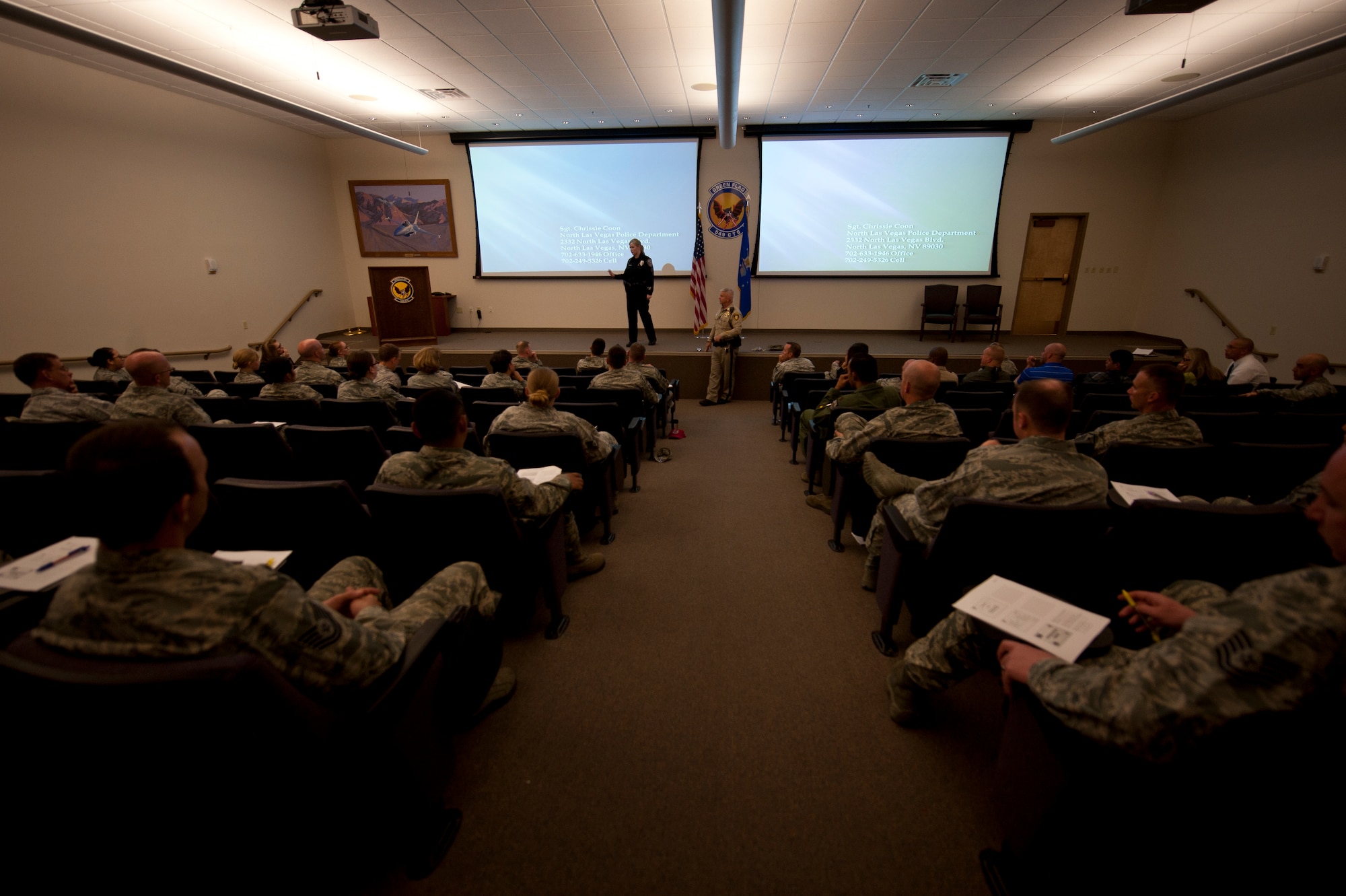 North Las Vegas Police Department Sgt. Chrissie Coon and Las Vegas Metropolitan Police Department Capt. Rich Fletcher field questions during a behavioral health leadership forum at Nellis Air Force Base, Nev., Sept. 30, 2014. During the forum, representatives from off-base law enforcement and healthcare agencies met with base leadership to discuss ways to cohesively attack issues like domestic violence, alcohol abuse, and depression which may affect Nellis-assigned personnel during their tenure in Southern Nevada. (U.S. Air Force photo by Staff Sgt. Siuta B. Ika)