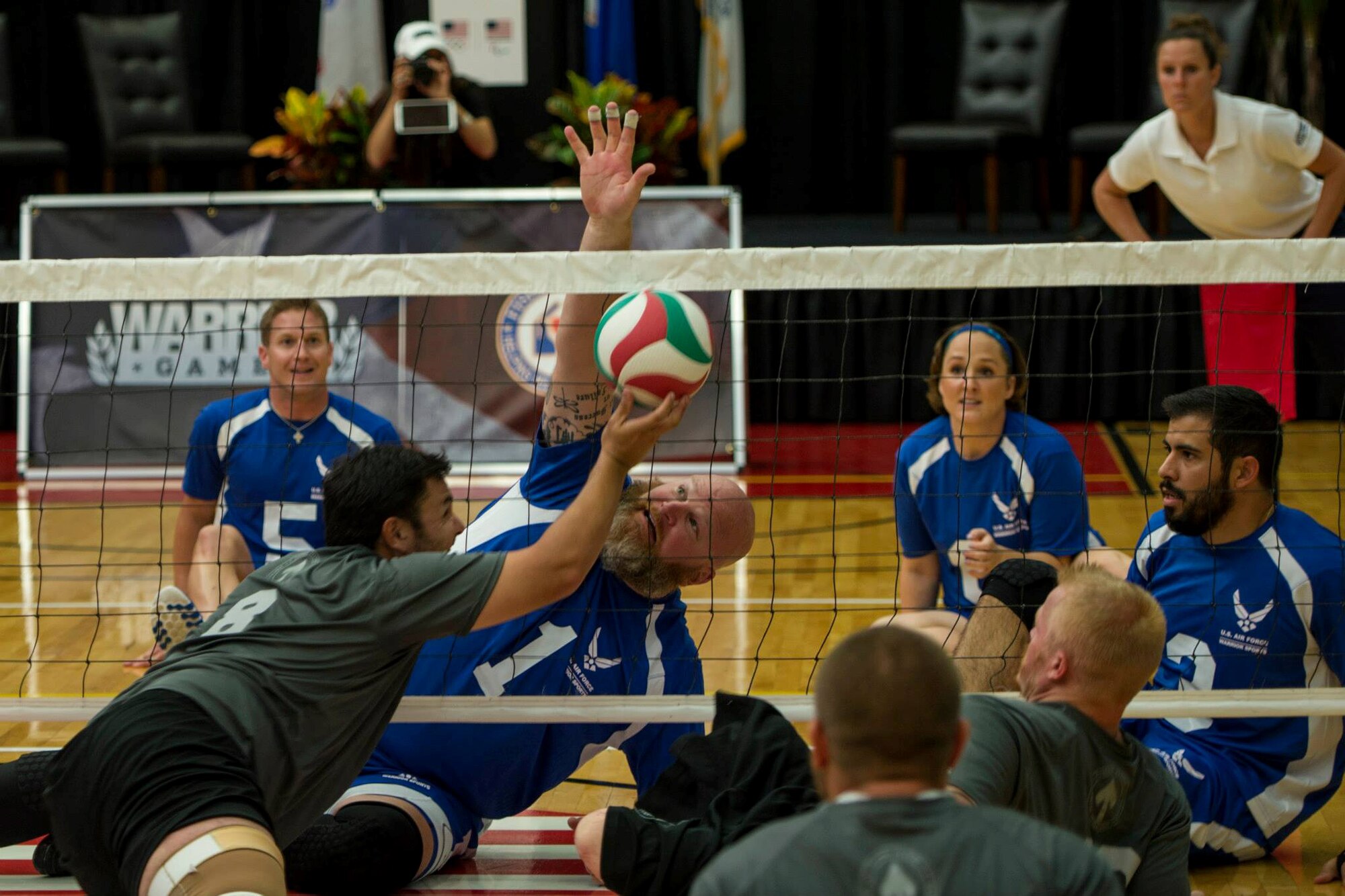 The U.S. Air Force team blocks a ball during a match of sitting volleyball at the opening day of the Wounded Warrior Games September 28, 2014 at the Olympic Training Center in Colorado Springs, Colorado. The 2014 Warrior Games features wounded athletes from throughout the Department of Defense who compete in Olympic style events for their respective military branch. The goal of the games is to help highlight the limitless potential of warriors through competitive sports. (U.S. Air Force photo by Airman 1st Class Taylor Queen)