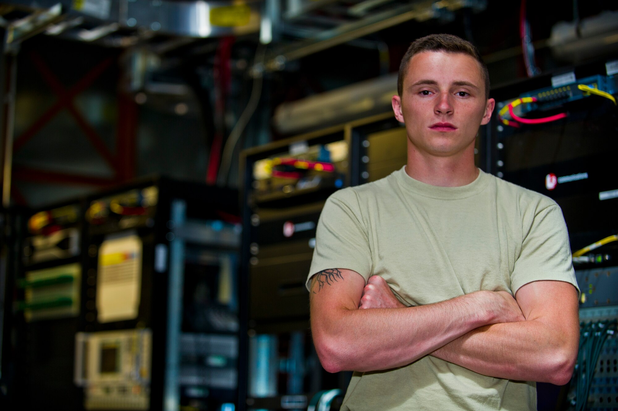 Airman 1st Class Tyler Christian, 49th Communications Squadron ground control station maintainer poses in the satellite communications room for Team Holloman’s Remotely Piloted Aircraft at Holloman Air Force Base, N.M., 25 Sept. As a ground control station maintainer, one of the key aspects of Christian’s job is establishing a clean connection to the satellites that allow the pilots to remotely pilot aircraft from thousands of miles away. Holloman AFB is home to the primary training facilities for all RPA pilots and sensor operators in the Air Force, the program is responsible for preparing the flight crews for real-world combat missions down the road. (U.S. Air Force photo by Senior Airman Daniel E.F. Liddicoet/Released)