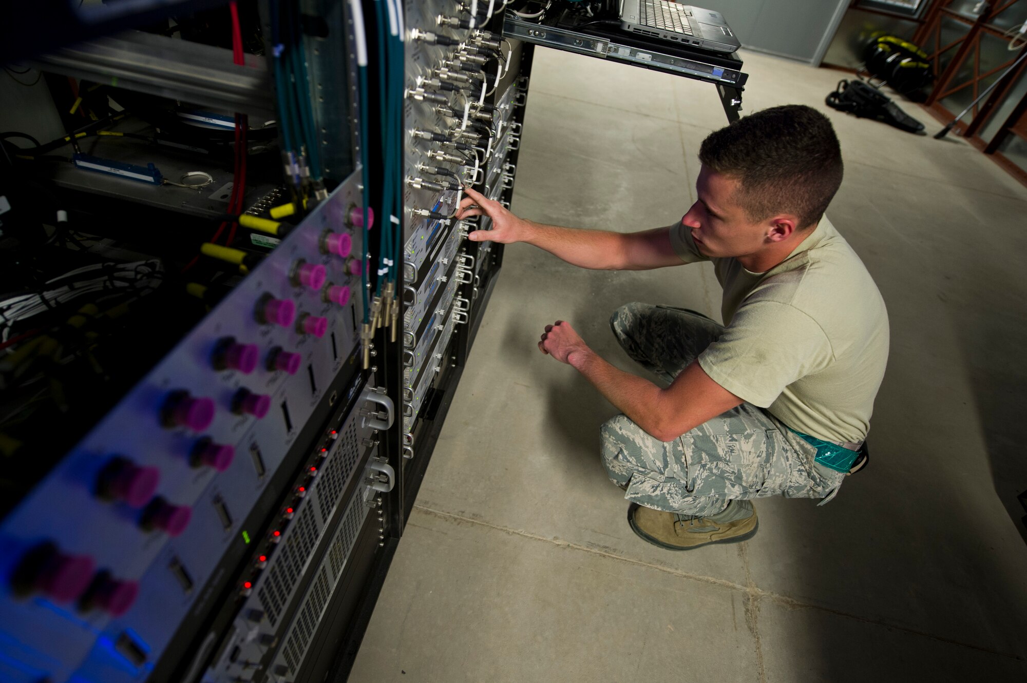 Airman 1st Class Tyler Christian, 49th Communications Squadron ground control station maintainer, works to secure a satellite connection for Remotely Piloted Aircraft at Holloman Air Force Base, N.M., 25 Sept. As a ground control station maintainer, one of the key aspects of Christian’s job is establishing a clean connection to the satellites that allow the pilots to remotely pilot aircraft from thousands of miles away. Holloman AFB is home to the primary training facilities for all RPA pilots and sensor operators in the Air Force, the program is responsible for preparing the flight crews for real-world combat missions down the road. (U.S. Air Force photo by Senior Airman Daniel E.F. Liddicoet/Released)