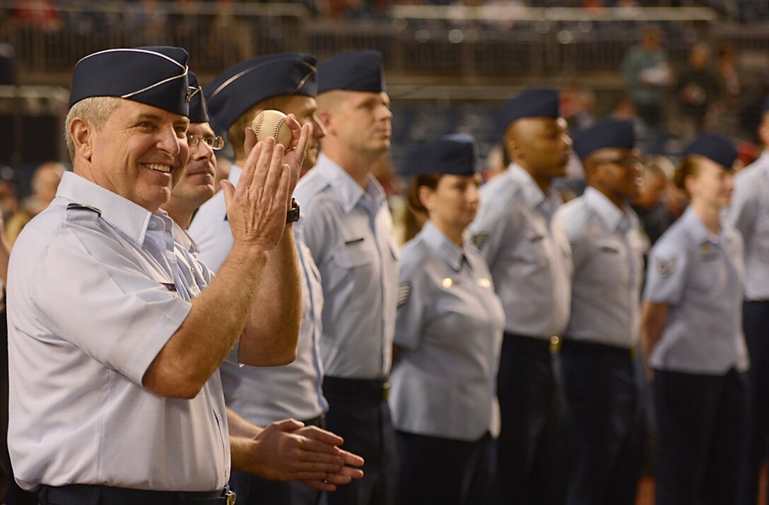 Air Force Chief of Staff Gen. Mark A. Welsh III applauds with Airmen during the Nationals' "Air Force Salute" at Nationals Park, Washington, D.C., Sept. 25, 2014.  The Nationals celebrated the Air Force birthday with Secretary of the Air Force Deborah Lee James throwing the first pitch, Welsh delivering the first ball, and approximately 50 Airmen lined the field to open the game with the New York Mets.  (U.S. Air Force photo/Scott M. Ash)