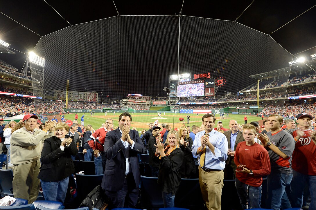 Fans of Nationals' baseball applaud Airmen during a game against New York Mets during the Nationals' "Air Force Salute" at Nationals Park, Washington, D.C., Sept. 25, 2014.  The Nationals celebrated the Air Force birthday with Secretary of the Air Force Deborah Lee James throwing the first pitch and Air Force Chief of Staff Gen. Mark A. Welsh III delivering the first ball, and approximately 50 Airmen lined the field to open the game with the New York Mets.  (U.S. Air Force photo/Scott M. Ash)