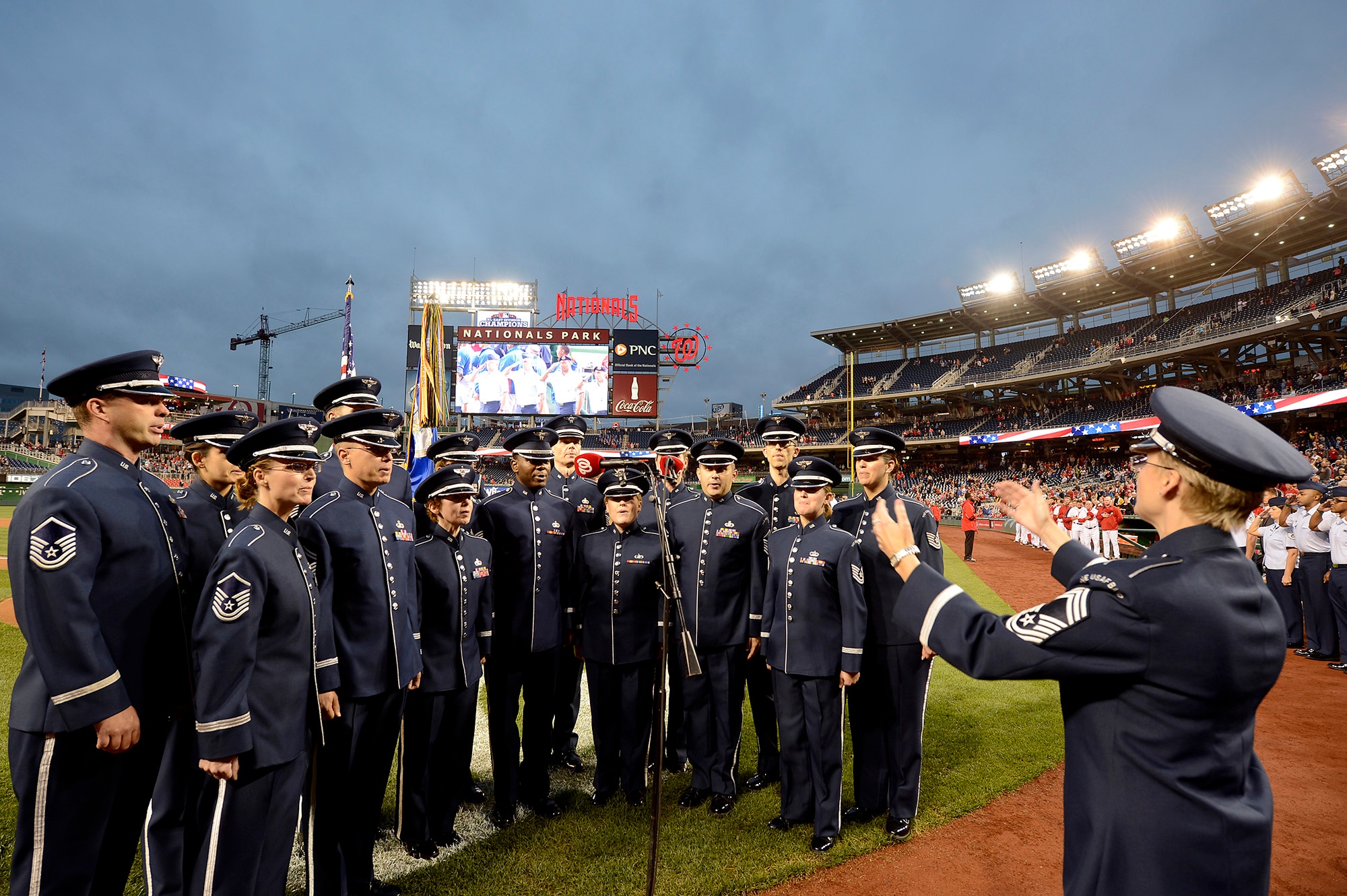 Members of the Air Force Band's Singing Sergeants perform the National Anthem at the Nationals' "Air Force Salute" at Nationals Park, Washington, D.C., Sept. 25, 2014.  The Nationals celebrated the Air Force birthday with Secretary of the Air Force Deborah Lee James throwing the first pitch and Air Force Chief of Staff Gen. Mark A. Welsh III delivering the first ball, and approximately 50 Airmen lined the field to open the game with the New York Mets.  (U.S. Air Force photo/Scott M. Ash)