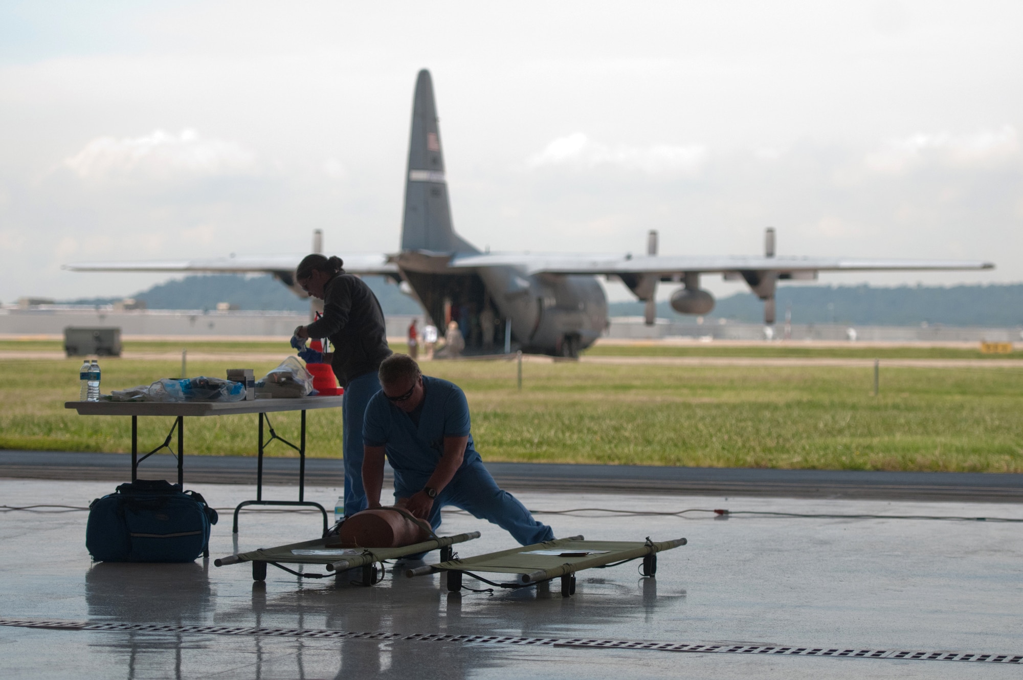 Nurses from the Louisville Veterans Affairs Medical Center evaluate a training manikin that simulates a patient who had been evacuated from a disaster site during a National Disaster Medical System exercise at the Kentucky Air National Guard base in Louisville, Ky., on Sept. 9, 2014. The Kentucky Air Guard’s C-130 aircraft were used during the exercise to provide a training platform for patient arrivals. (U.S. Air National Guard photo by Master Sgt. Phil Speck)