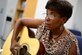 U.S. Army Lt. Col Annette Morris, Warrior Transition Unit patient, practices playing guitar at a guitar therapy program lesson at Fort Eustis, Va., Sept. 30, 2014. Two days each week the WTU holds guitar lessons for their members as a way to help with their healing. (U.S. Air Force photo by Airman 1st Class Kimberly Nagle/Released)