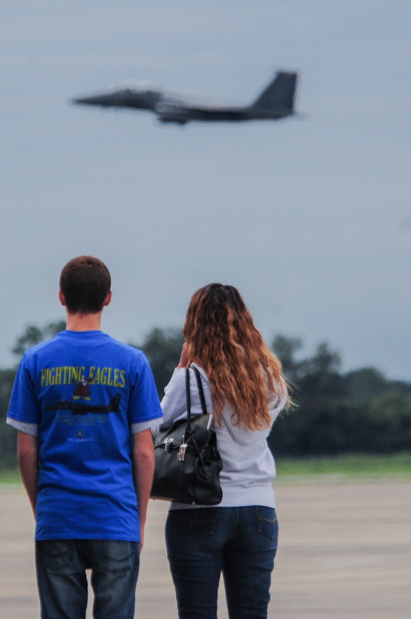 (From left) Jonathan Dase and his mom, Billie, watch as an F-15E Strike Eagle takes off during their visit to Seymour Johnson Air Force Base, North Carolina, on Sept. 23, 2014. The 334th Fighter Squadron hosted Dase as part of their Pilot for a Day program. Dase suffers from a rare eye condition called keratoconus, which will prevent him from living out his dream of joining the Air Force. (U.S. Air Force photo/Airman 1st Class Brittain Crolley)